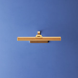 Smaller Marcel cordless picture light in antique brass finish