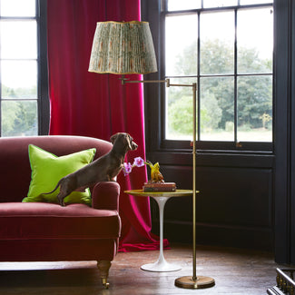 Swing articulated floor lamp in antiqued brass
