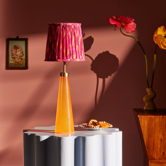 Cueva cordless table lamp in neon orange by Matthew Williamson