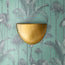Half Moon wall sconce in antiqued brass