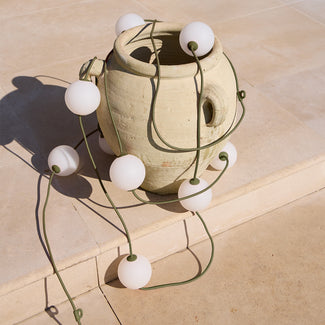 Heidi solar string lights in moss by the Novogratz