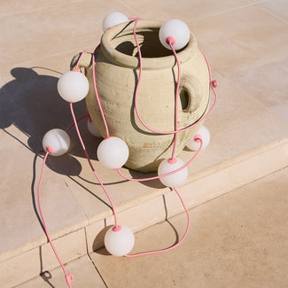 Heidi solar string lights in blush by the Novogratz