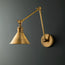 Stork wall sconce in antiqued brass