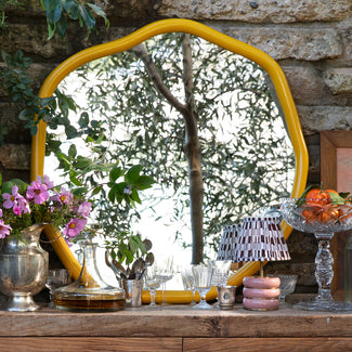 Brandy mirror in sand by the Novogratz