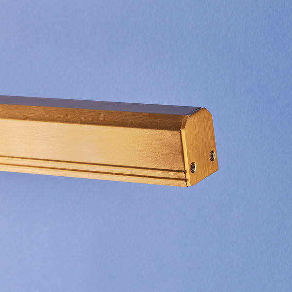 Larger Marcel cordless picture light in antique brass finish