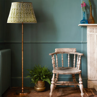 Chukka floor lamp in antiqued brass