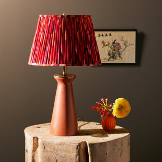 Cala table lamp in terracotta finish by Matthew Williamson