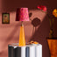 Cueva cordless table lamp in neon orange by Matthew Williamson