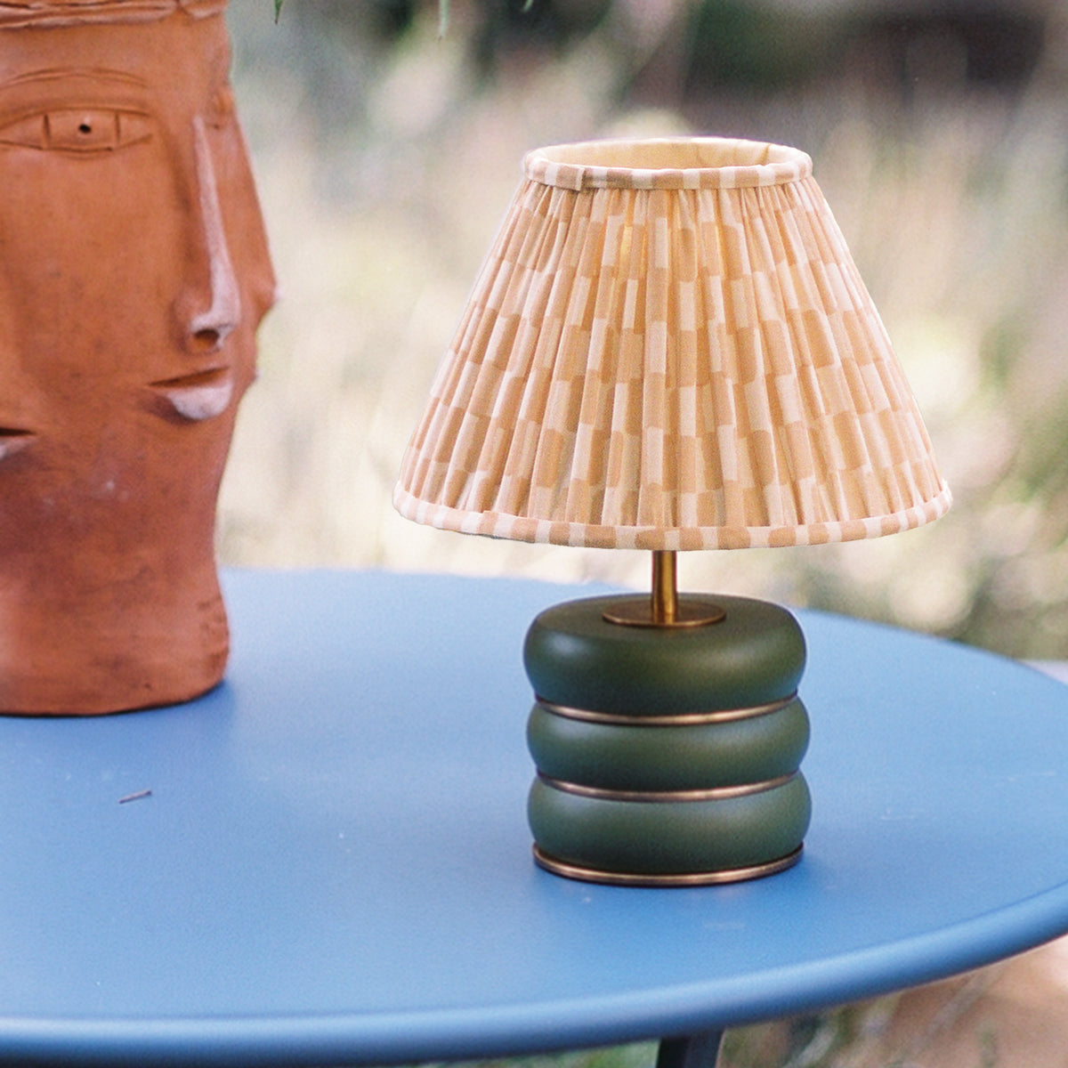Holleder cordless table lamp in Moss by the Novogratz