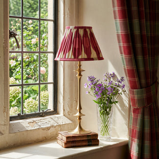 Spindle cordless table lamp in aged brass