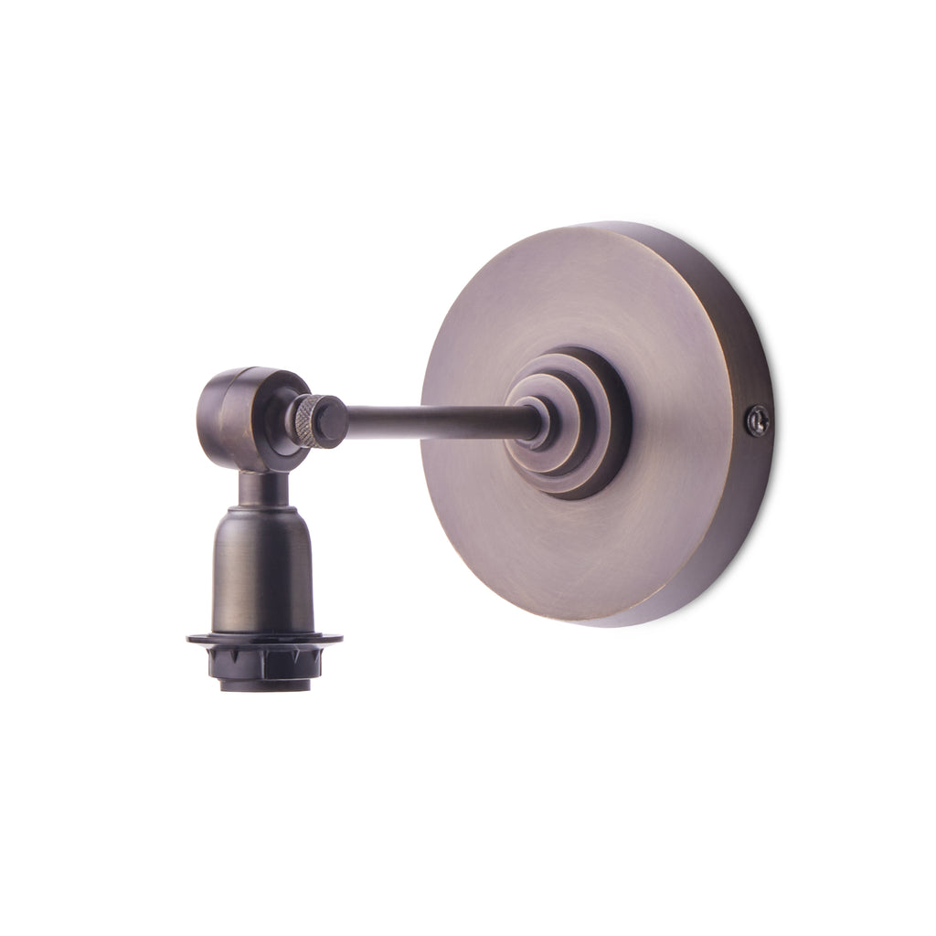 Elbow wall fixture in bronze