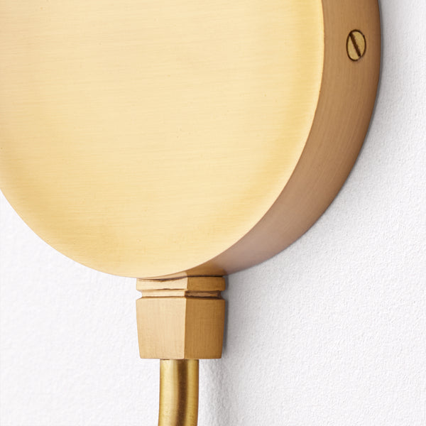 Gramma wall fixture in antiqued brass