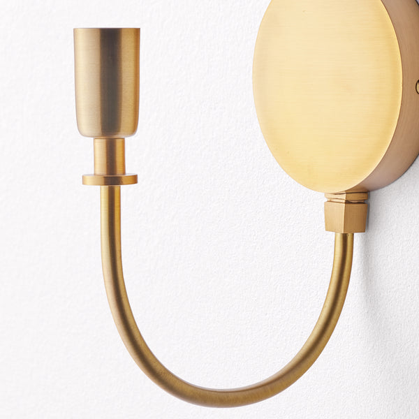 Gramma wall fixture in antiqued brass