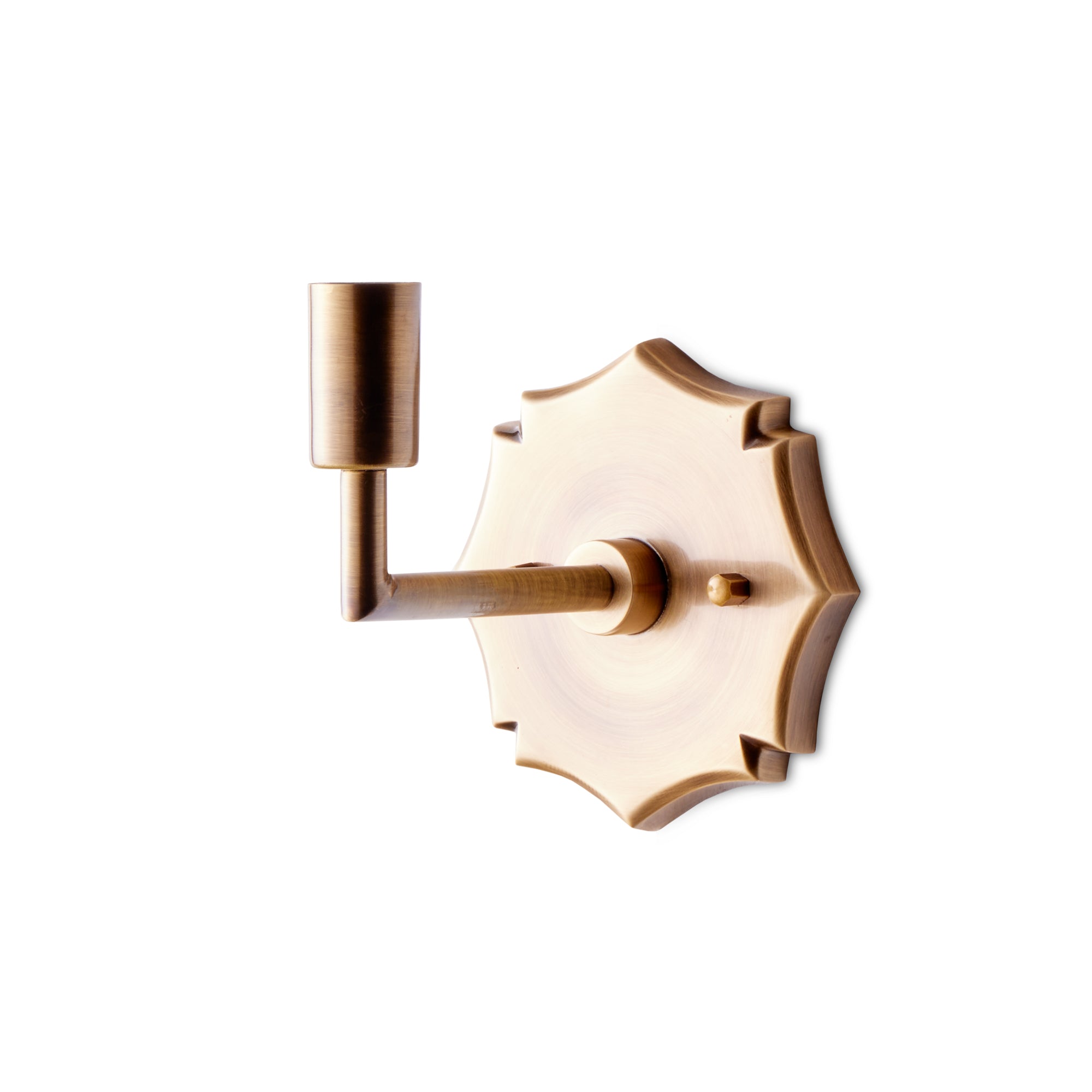 single insignia wall fixture in antiqued brass