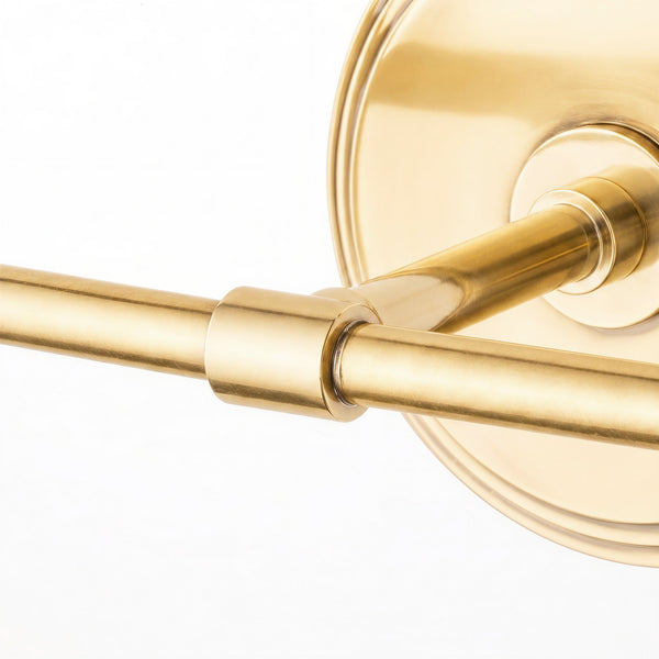 Double Chukka cordless wall fixture in antique brass