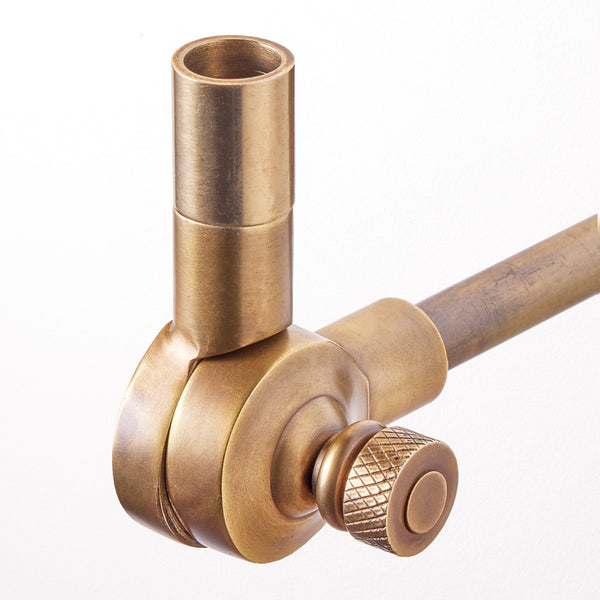 Elbow cordless wall fixture in antique brass