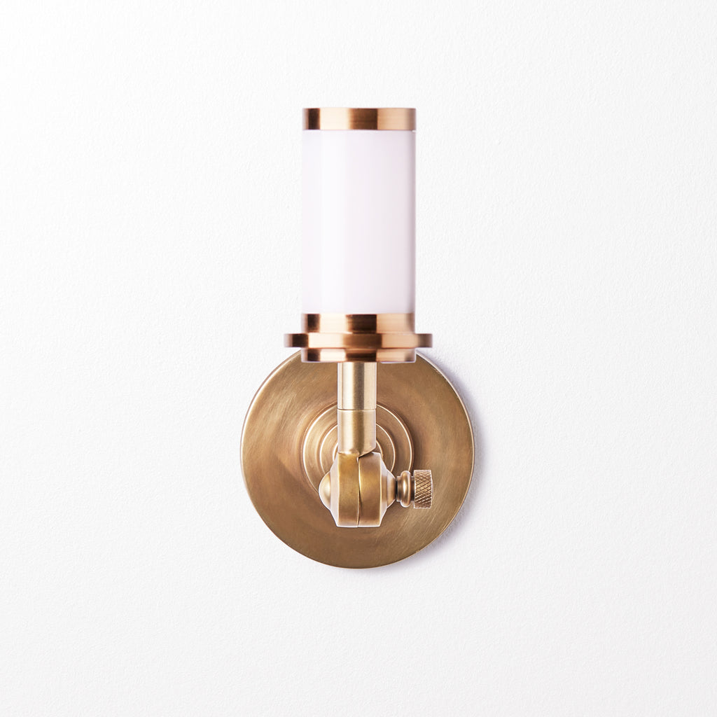 Elbow cordless wall fixture in antique brass