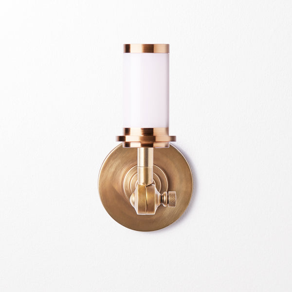 Elbow cordless wall fixture in antique brass