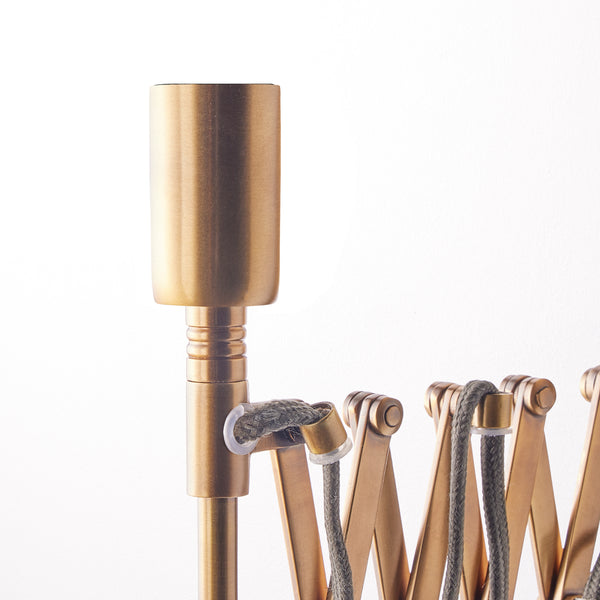 Tina wall fixture in antique brass