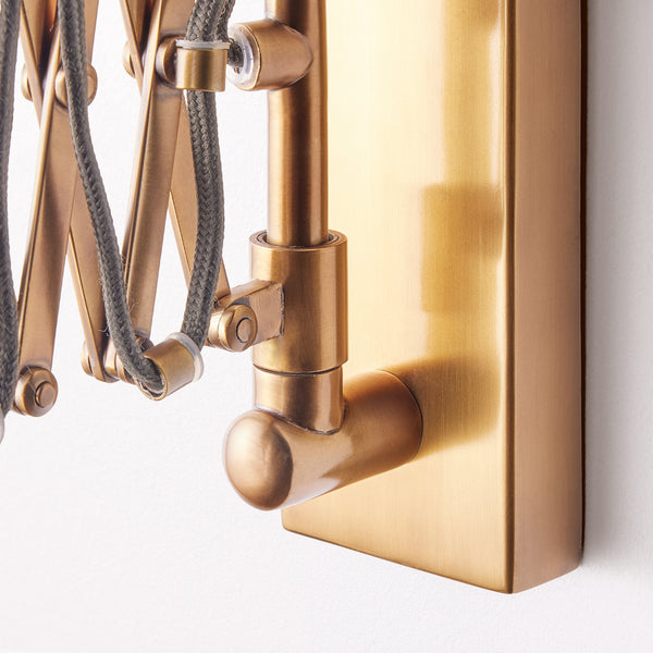 Tina wall fixture in antique brass