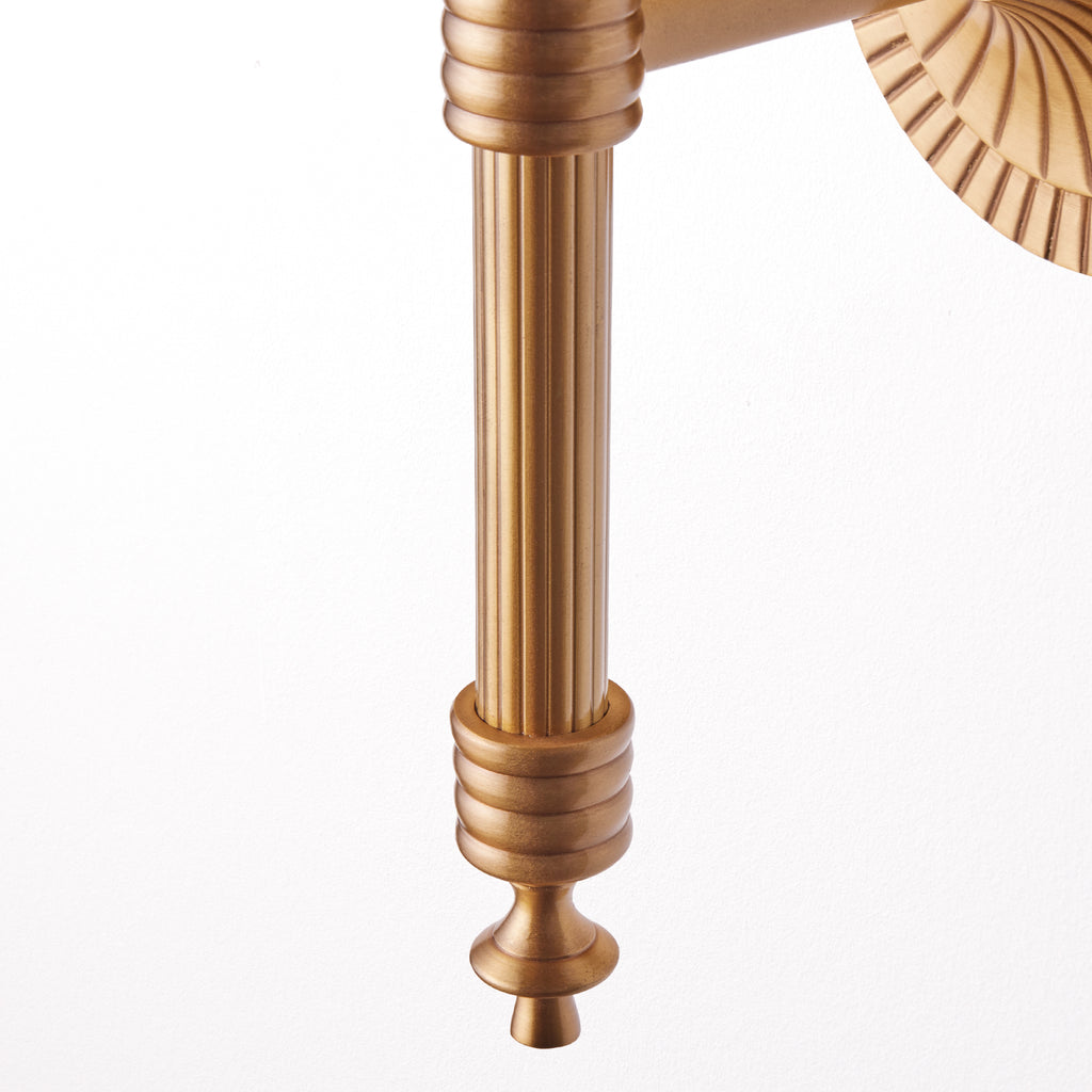 Wrappling wall fixture in antiqued brass