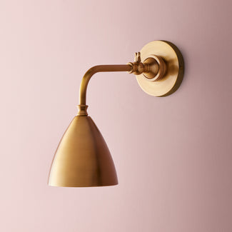 Clematis wall sconce in antiqued Brass
