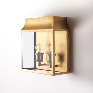 Double Crail wall sconce in antiqued brass