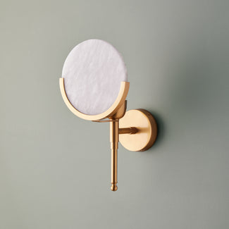 Firefly wall sconce in antiqued brass with an alabaster globe