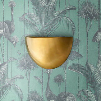 Half Moon wall sconce in antiqued brass