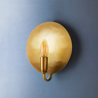 Moon wall sconce in antiqued brass