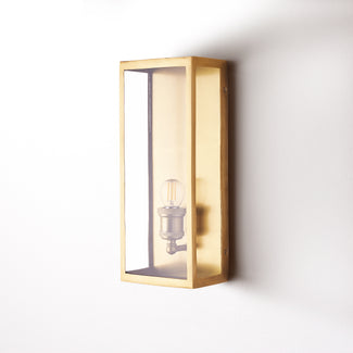 Long and thin Orford wall sconce in antiqued brass