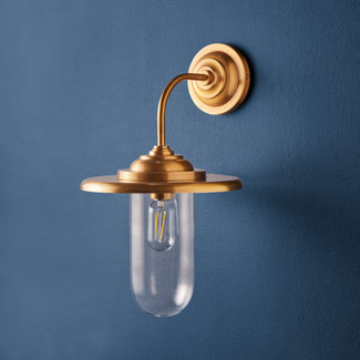 Peewit wall sconce in antiqued brass