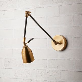 Pick wall sconce in black and antiqued brass