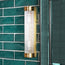 Long Roddy wall sconce in antiqued brass with glass rods