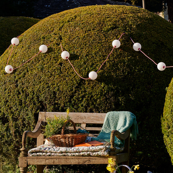 Heidi solar string lights in blush by the Novogratz