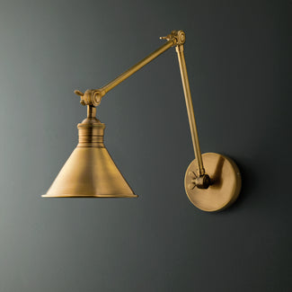 Stork wall sconce in antiqued brass
