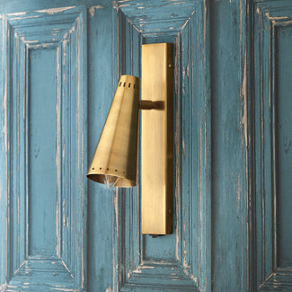 Victor wall sconce in antiqued brass